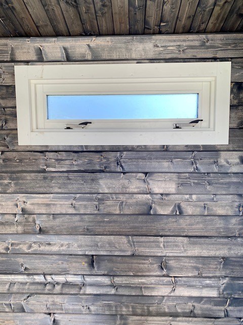 White window internal dark timber walls