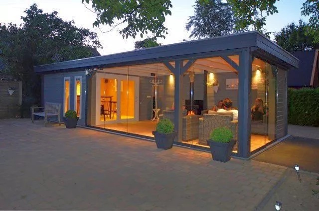 Large garden room with glass sliding walls