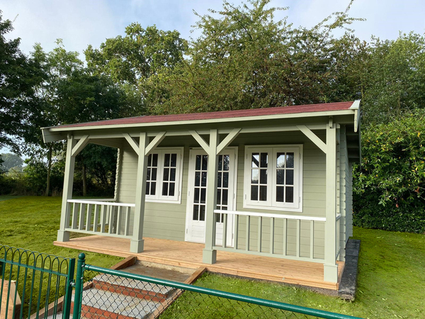 Timber garden room green with fence