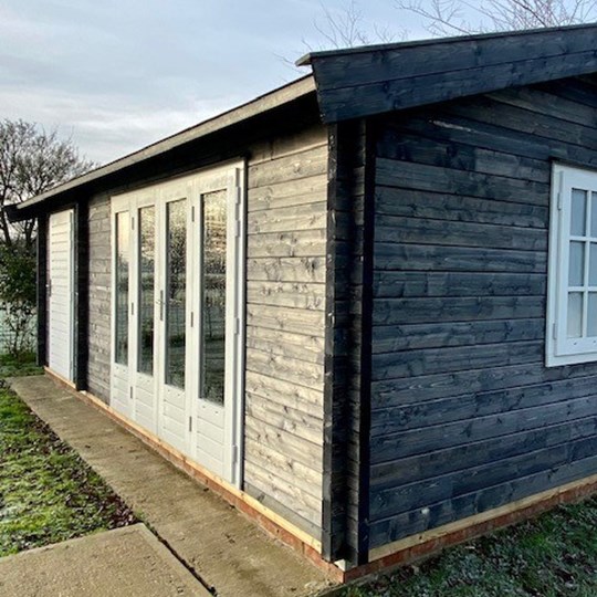 Black roof dark walls timber building luxury