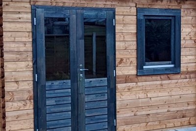 Double doors and window stained dark wood