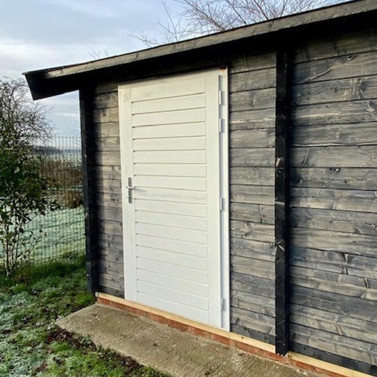 Black roof dark walls timber building luxury