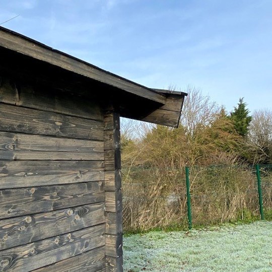 Black roof dark walls timber building luxury