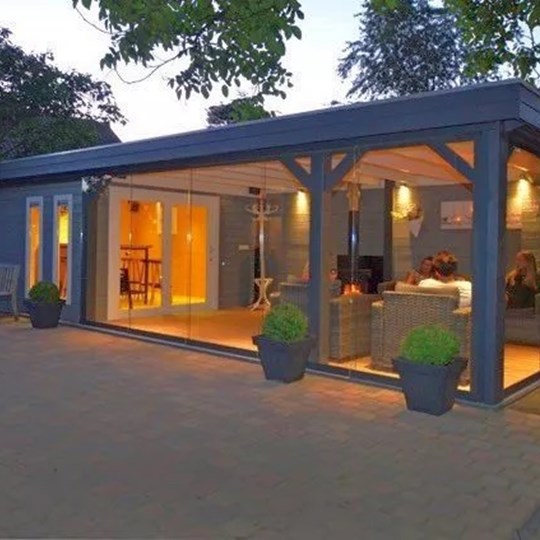 Large garden room with glass sliding walls